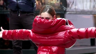 Futuristic dance in Duvetica down jackets. Girls and guys in multi-colored shiny jackets