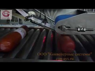 Наклаивание этикетки на колбасу с датером