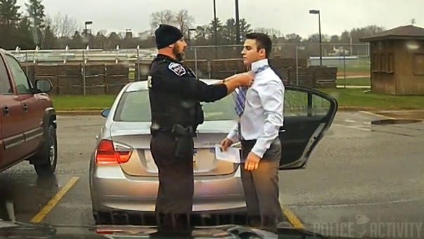 Dashcam: Police Officer Helps Speeding Student Tie His