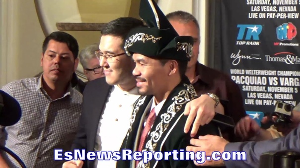 MANNY PACQUIAO MAKES DAY OF KAZAKHSTANIAN FAN; POSES IN TRADITIONAL SHAPAN ROBE GIFT FOR
